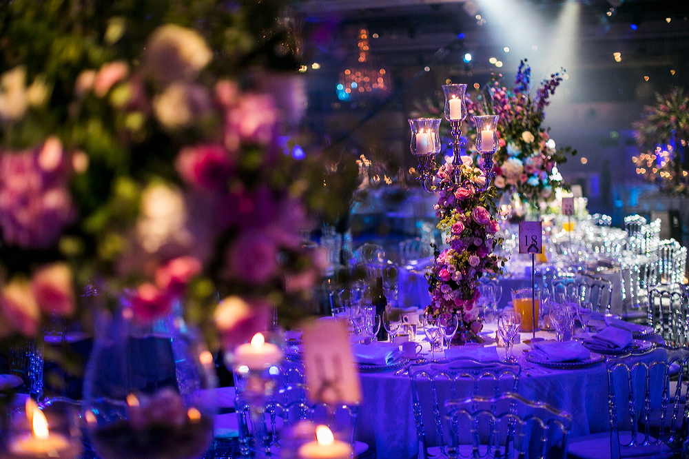 Wedding Reception at the Grosvenor House Great Room. Spriral of flowers around the candelabra